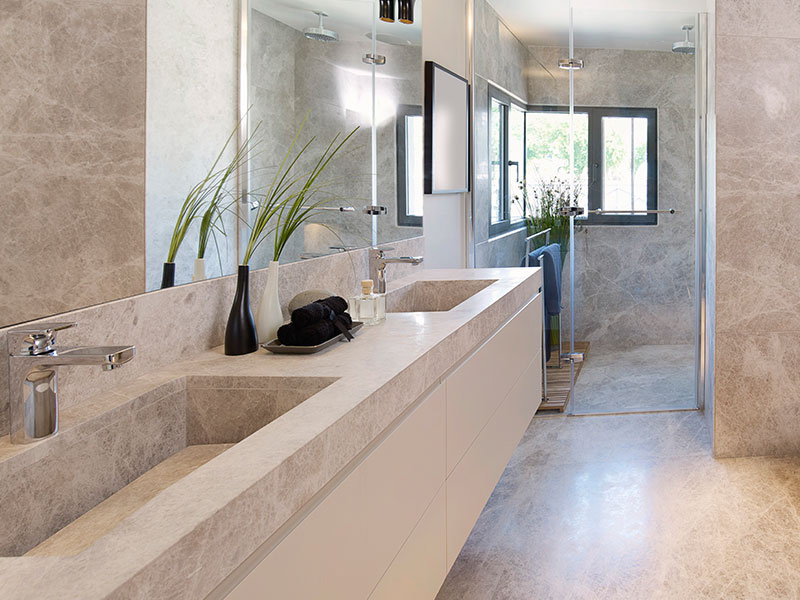 Stone vanity top in an Okotoks bathroom remodel, featuring low-maintenance quartz from A1 Granite & Marble.