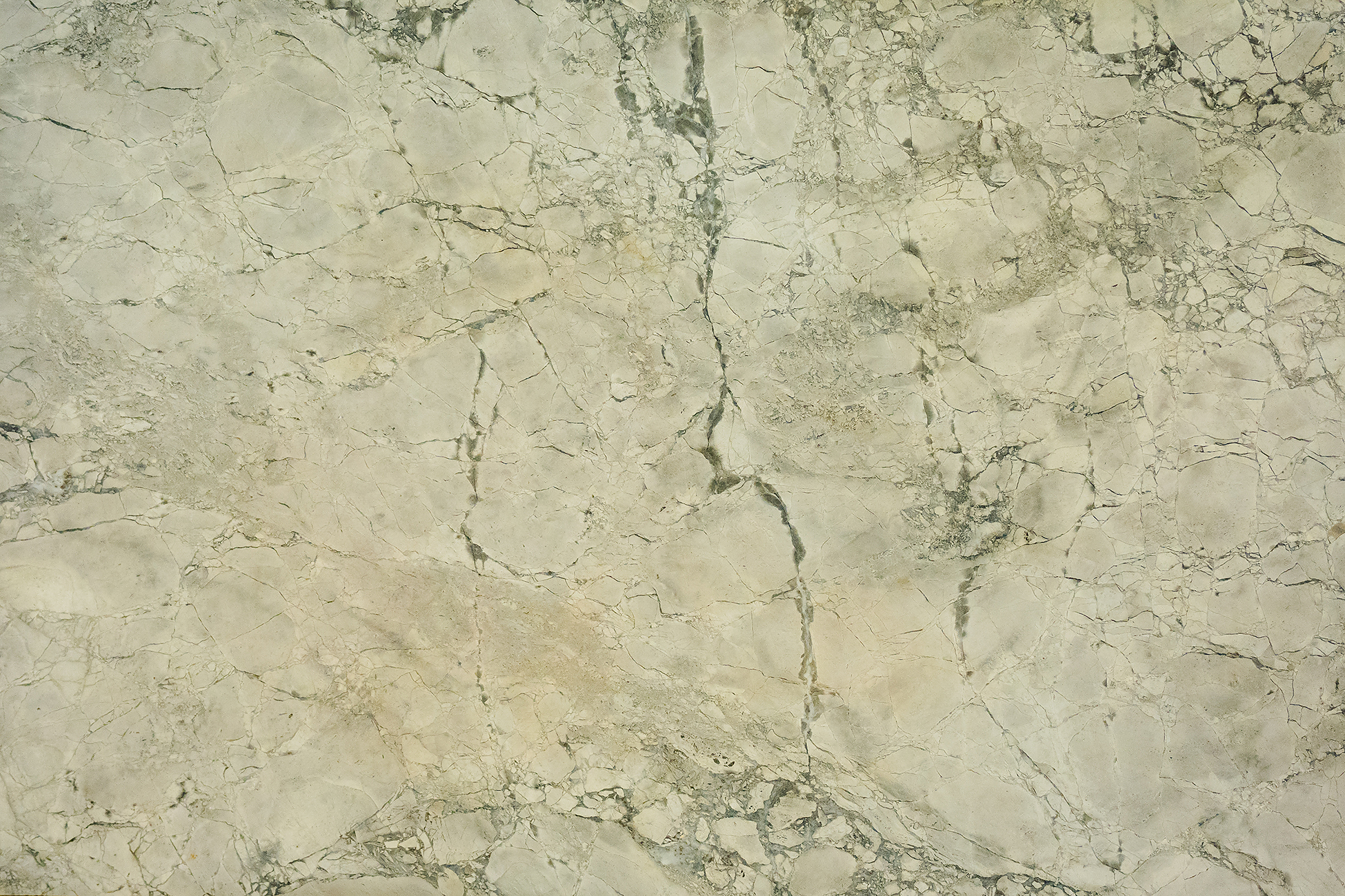 Close-up of stone surface in a bright family kitchen, representing low-maintenance kitchen countertops Calgary families use every day.